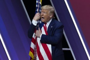 Trump says getting rid of “bad” people made him successful as he ‘dry humps’ the flag…again